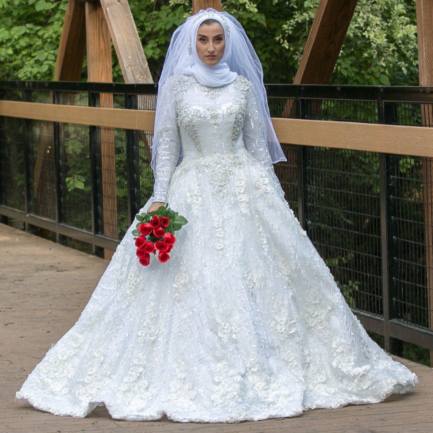 Elegant bridal dress for a Muslim wedding with a modest design and detailed embroidery