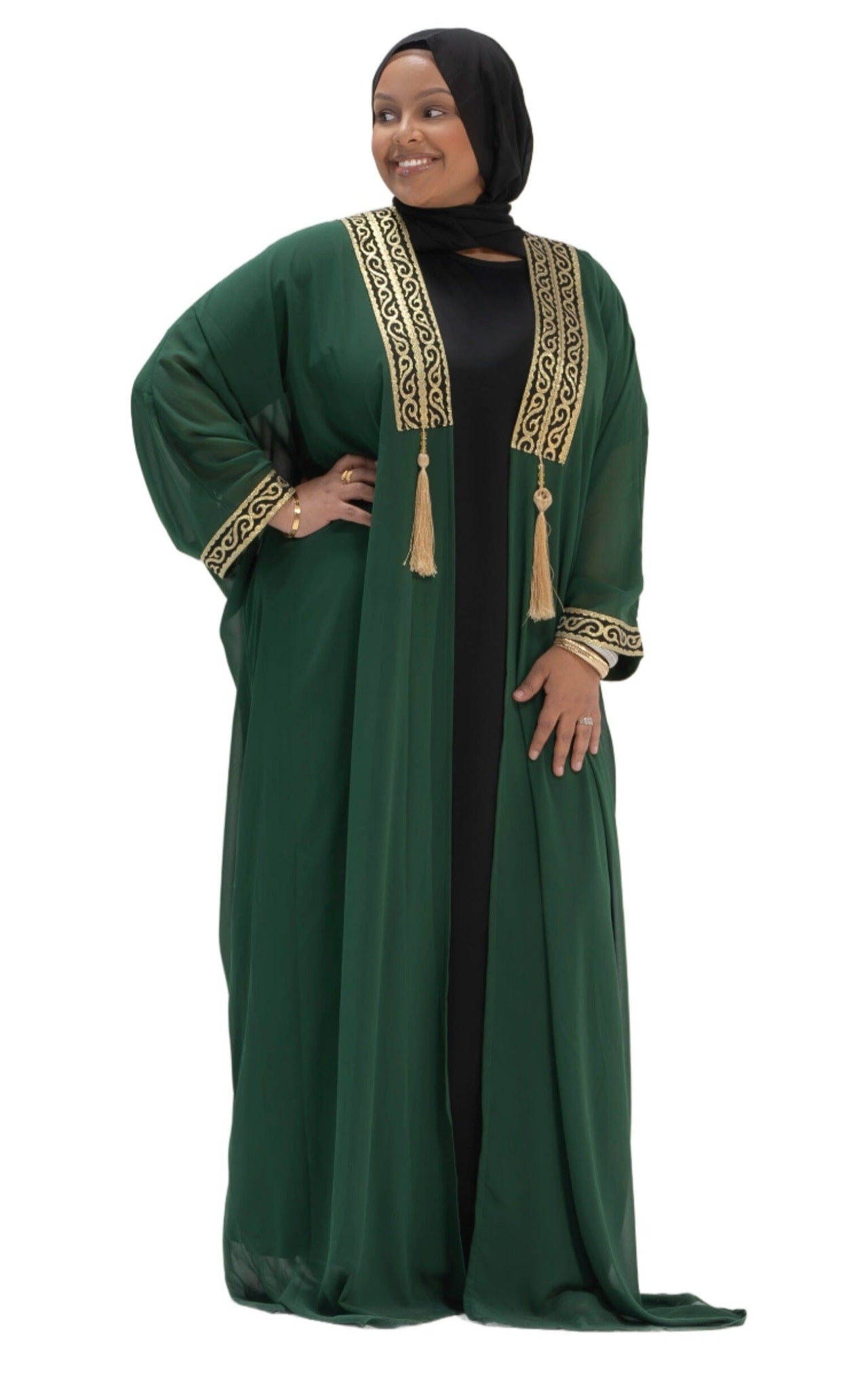 Emerald Enigma Cape Abaya – luxurious flowing abaya in deep emerald green with elegant cape-style sleeves and subtle intricate detailing.